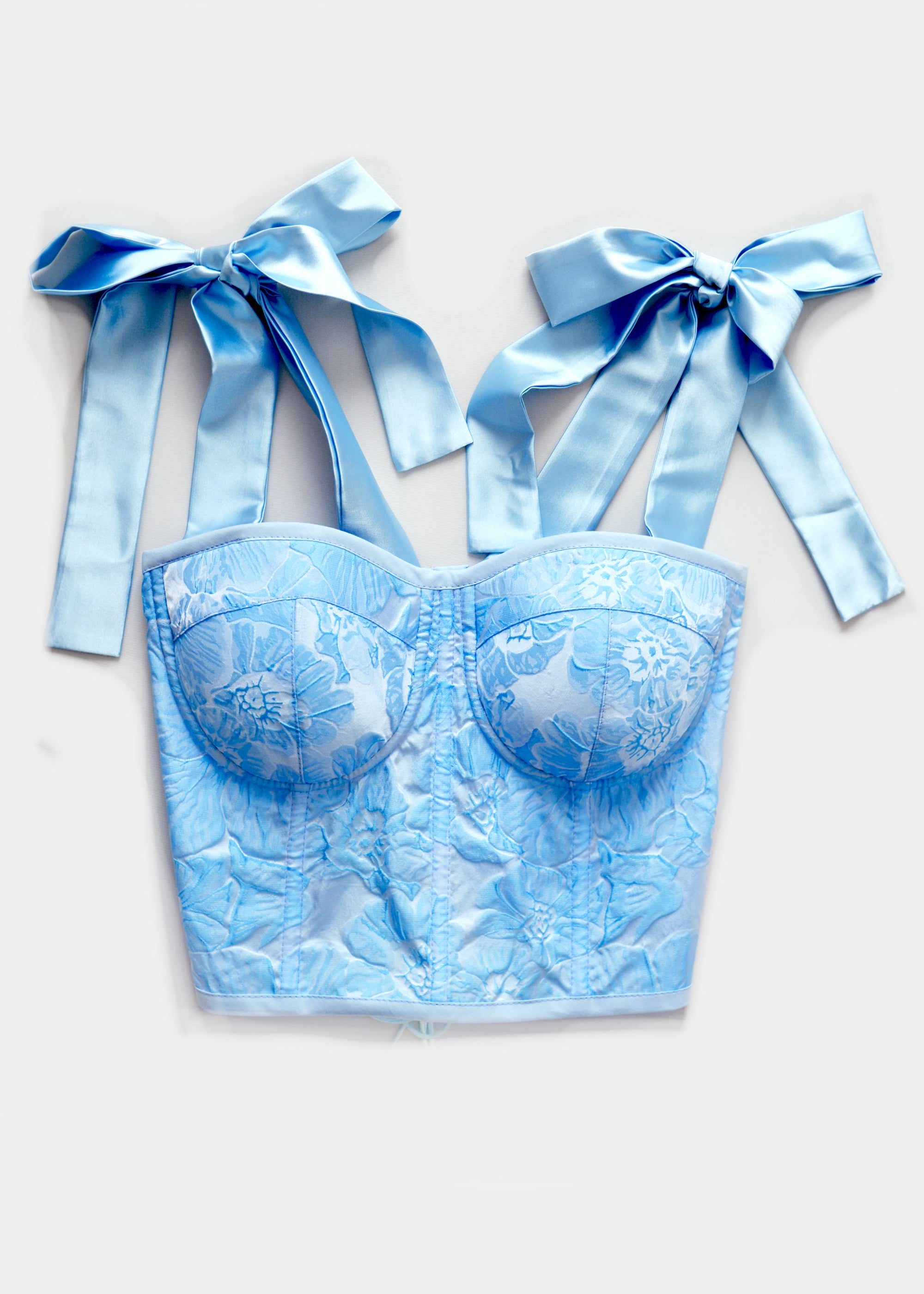 A WOMAN WITH A CORSET BLUE BROCARD CORSET
